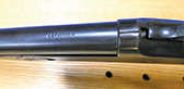 “44 caliber” is stamped on the top of the shotgun’s barrel.